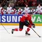 MINSK, BELARUS - MAY 11: Switzerland's Reto Schappi #19 on a breakaway as Belarus' Roman Graborenko #92 chases him down during preliminary round action at the 2014 IIHF Ice Hockey World Championship. (Photo by Andre Ringuette/HHOF-IIHF Images)